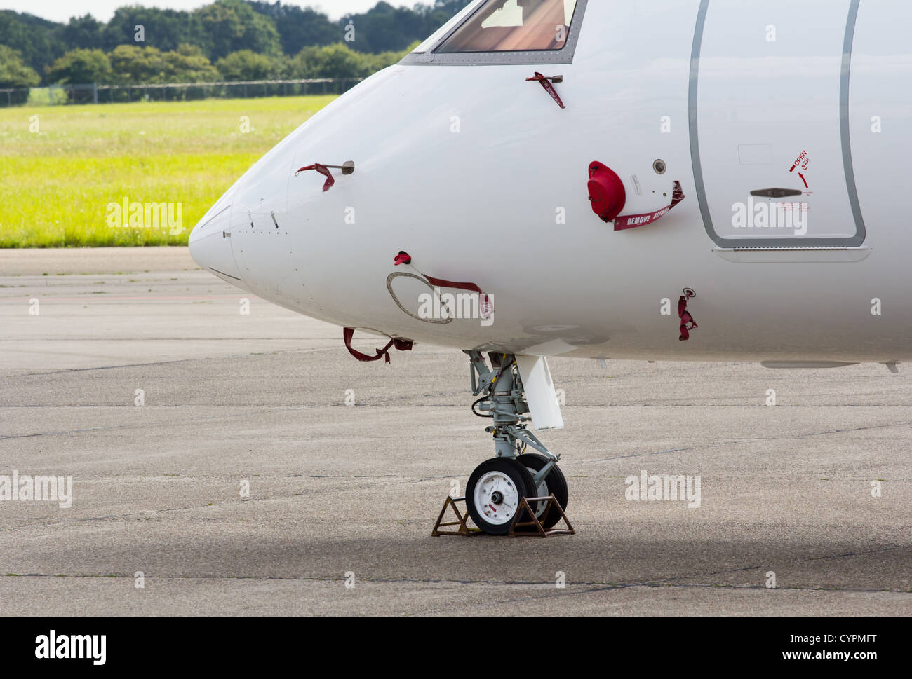 nose wheel of a parked jet aircraft Stock Photo