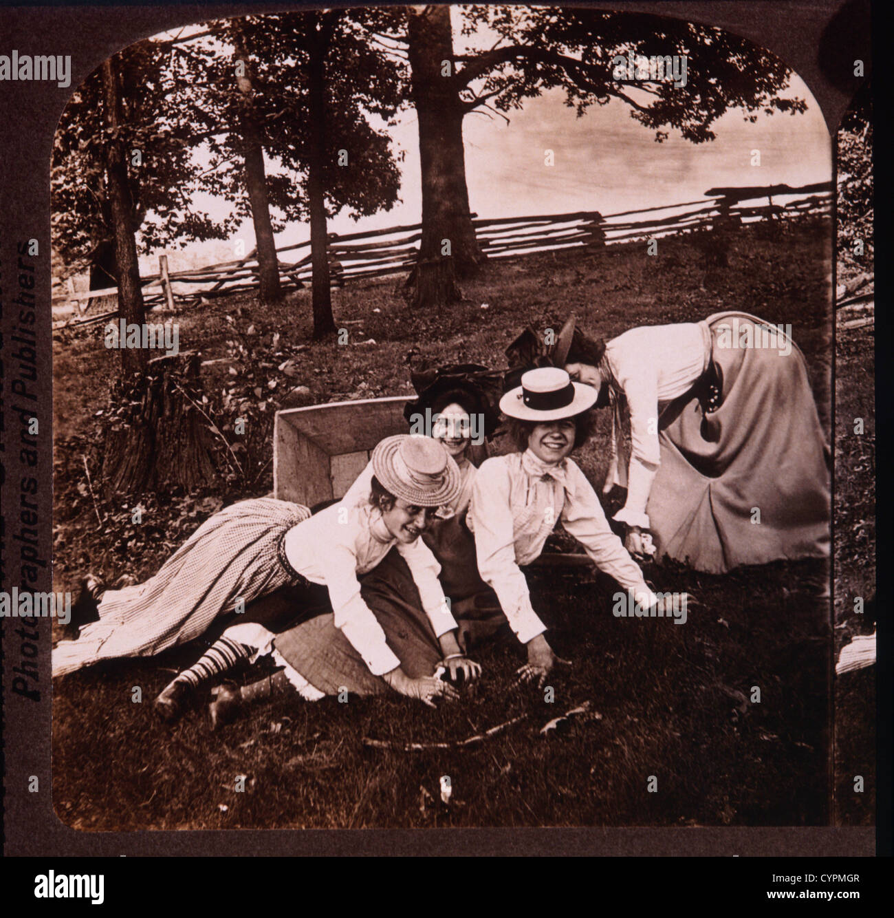Women Falling out of Wheel Barrow, Stereo Photograph, 1905 Stock Photo