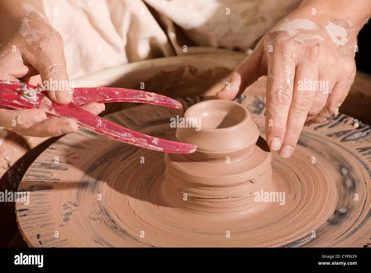 Potter using calipers to measure fresh clay pot Stock Photo Alamy