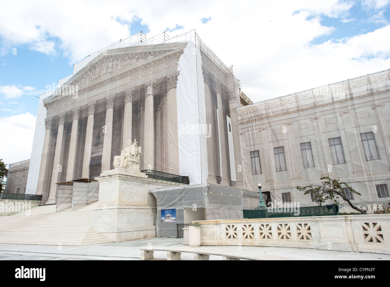 WASHINGTON DC, USA - While the US Supreme Court building is undergoing renovations, it is covered with a light scrim over the scaffolding that shows an image of the building as it was before the repairs and without the scaffolding. Stock Photo