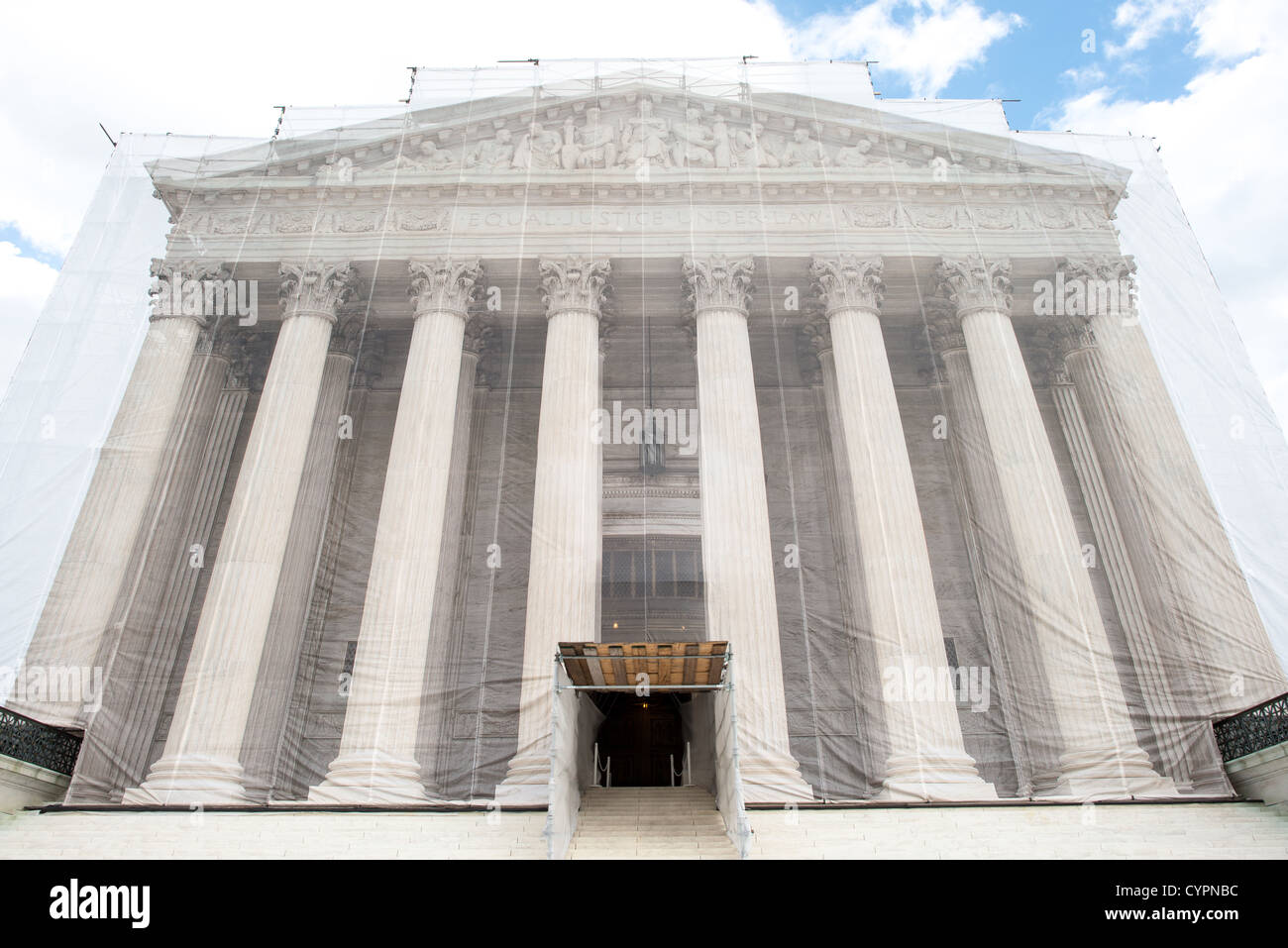 WASHINGTON DC, USA - While the US Supreme Court building is undergoing renovations, it is covered with a light scrim over the scaffolding that shows an image of the building as it was before the repairs and without the scaffolding. Stock Photo
