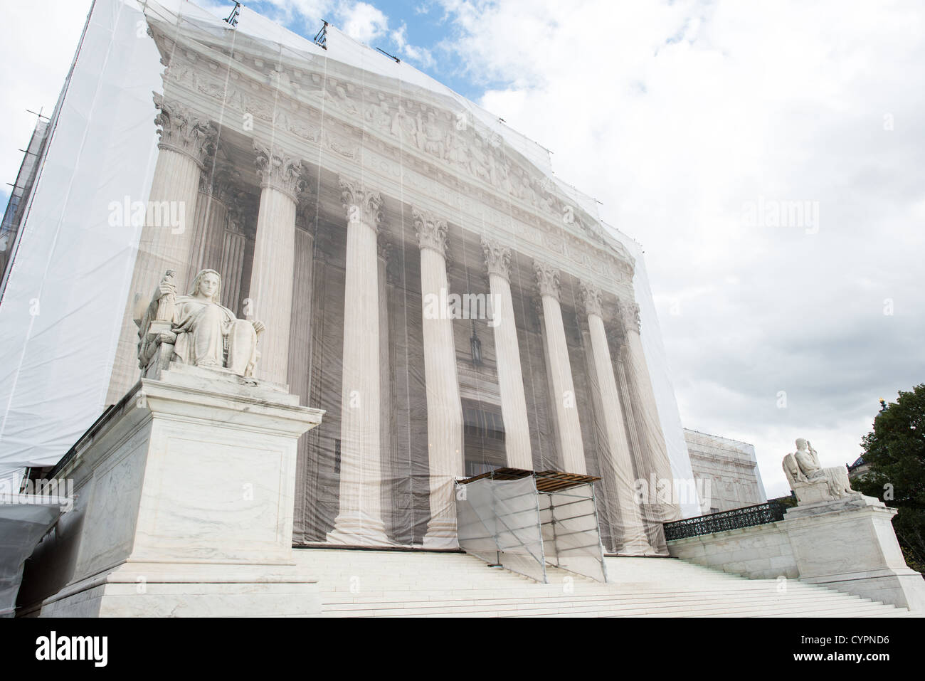 WASHINGTON DC, USA - While the US Supreme Court building is undergoing renovations, it is covered with a light scrim over the scaffolding that shows an image of the building as it was before the repairs and without the scaffolding. Stock Photo