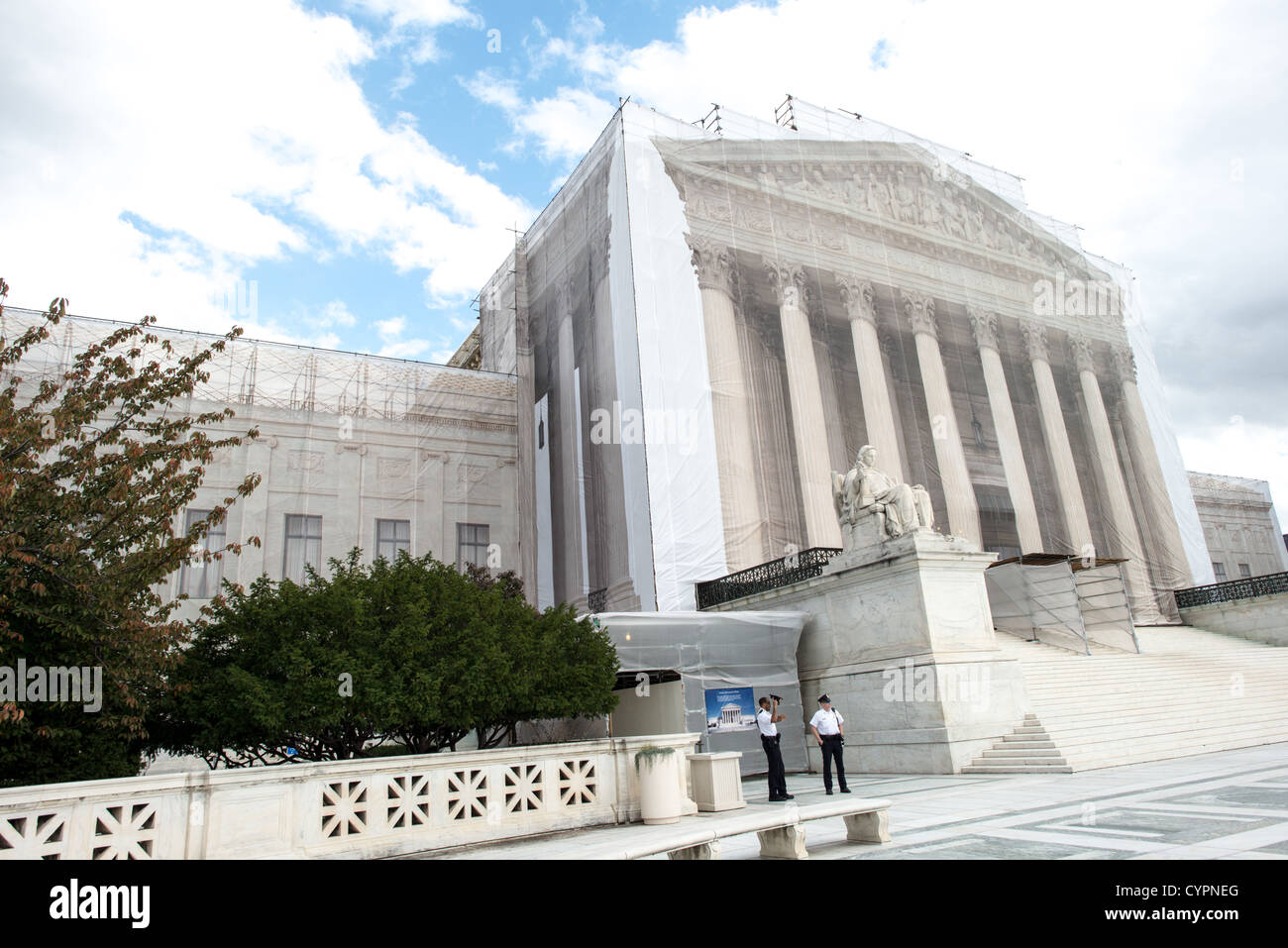 WASHINGTON DC, USA - While the US Supreme Court building is undergoing renovations, it is covered with a light scrim over the scaffolding that shows an image of the building as it was before the repairs and without the scaffolding. Stock Photo