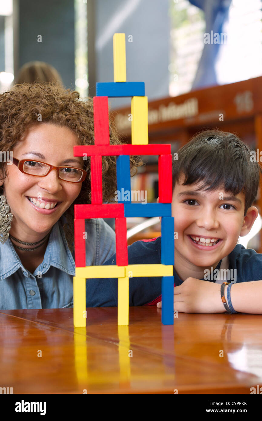 Hispanic boy playing with blocks hi-res stock photography and images ...