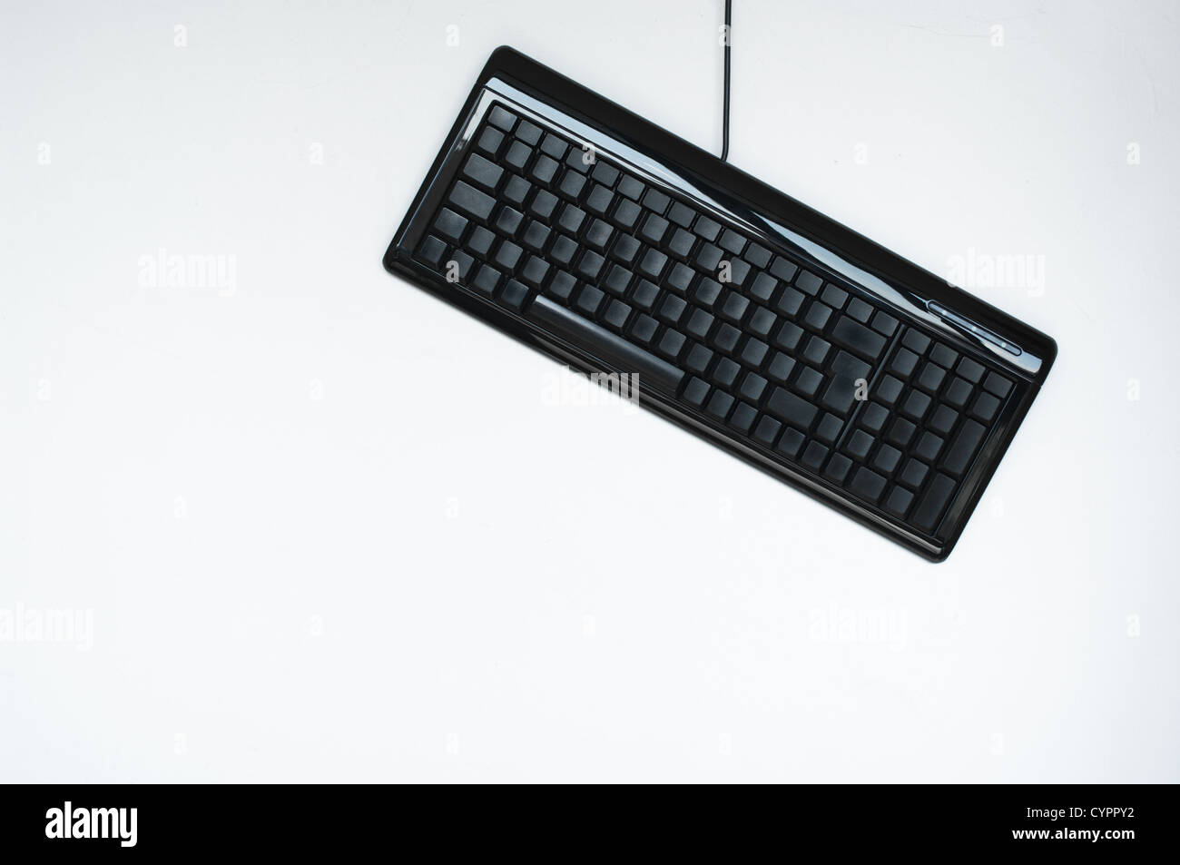 Isolated blank keyboard hanging on the wall Stock Photo