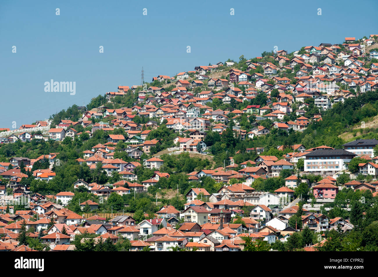 View of houses on the hills surrounding Sarajevo, the capital city of Bosnia and Herzegovina. Stock Photo
