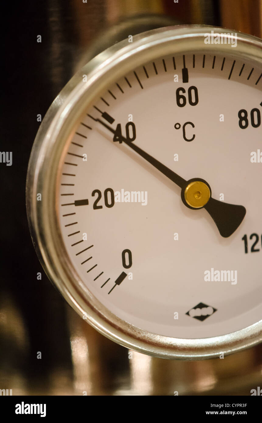 Detail Of An Industrial Thermometer On Machine Stock Photo