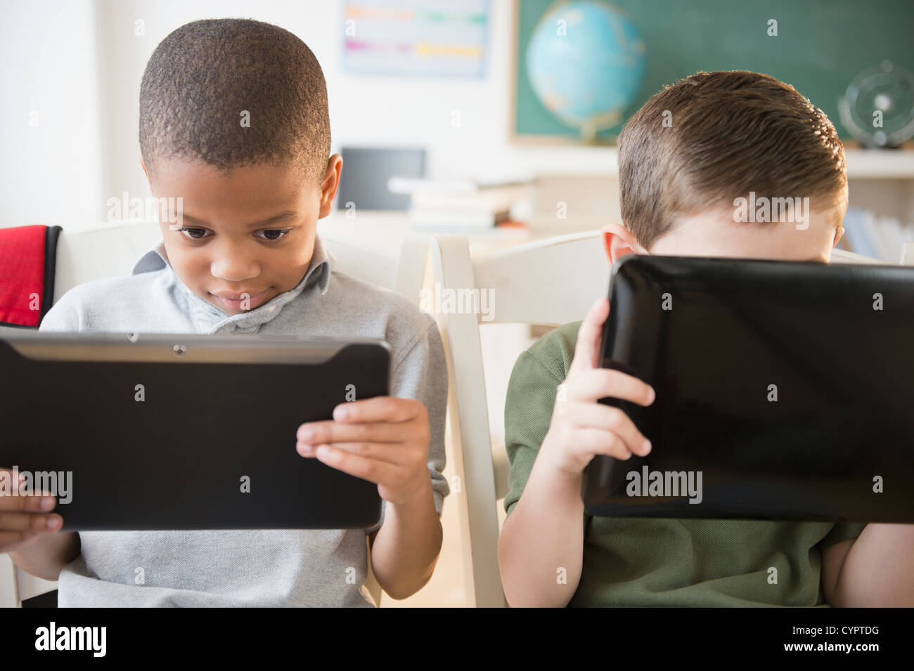 Students using digital tablets in classroom Stock Photo Alamy