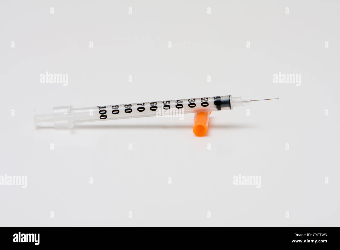 Insulin syringe with orange cap and needle, isolated Stock Photo Alamy