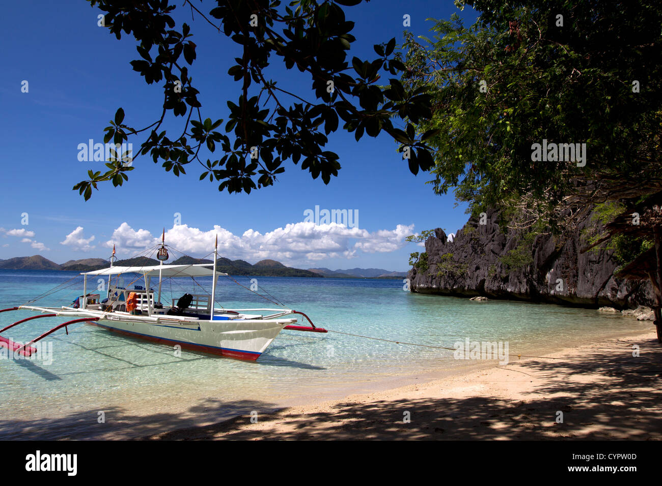 Banca boat moored on sandy beach,Coron Island,Palawan,Philippines Stock Photo
