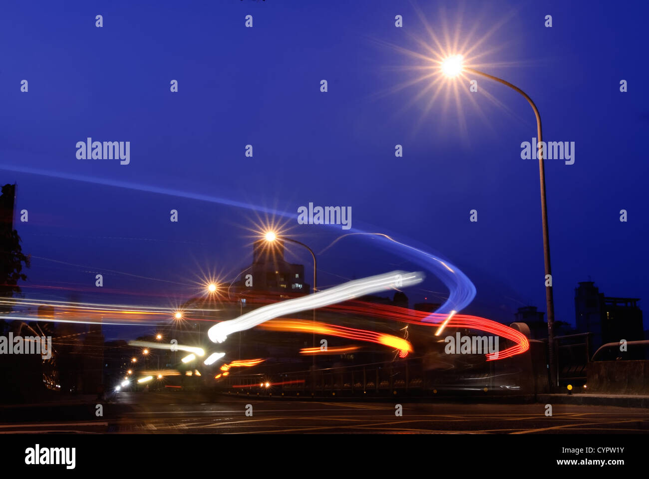 City night scene with color motion blurred line of cars Stock Photo - Alamy