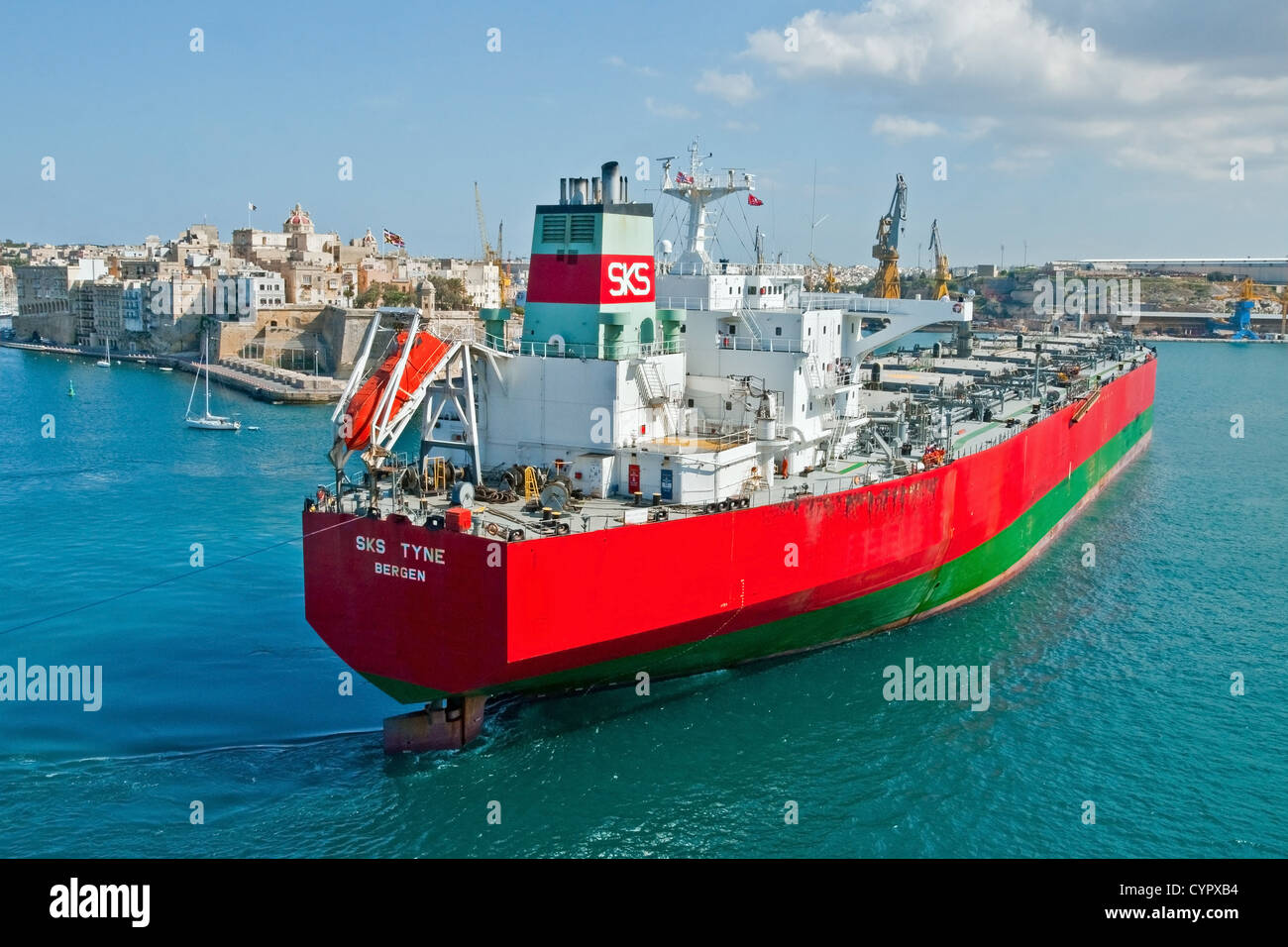 The supertanker 'SK Tyne' manouvres towards her berth in Grand Harbour, Malta. Stock Photo