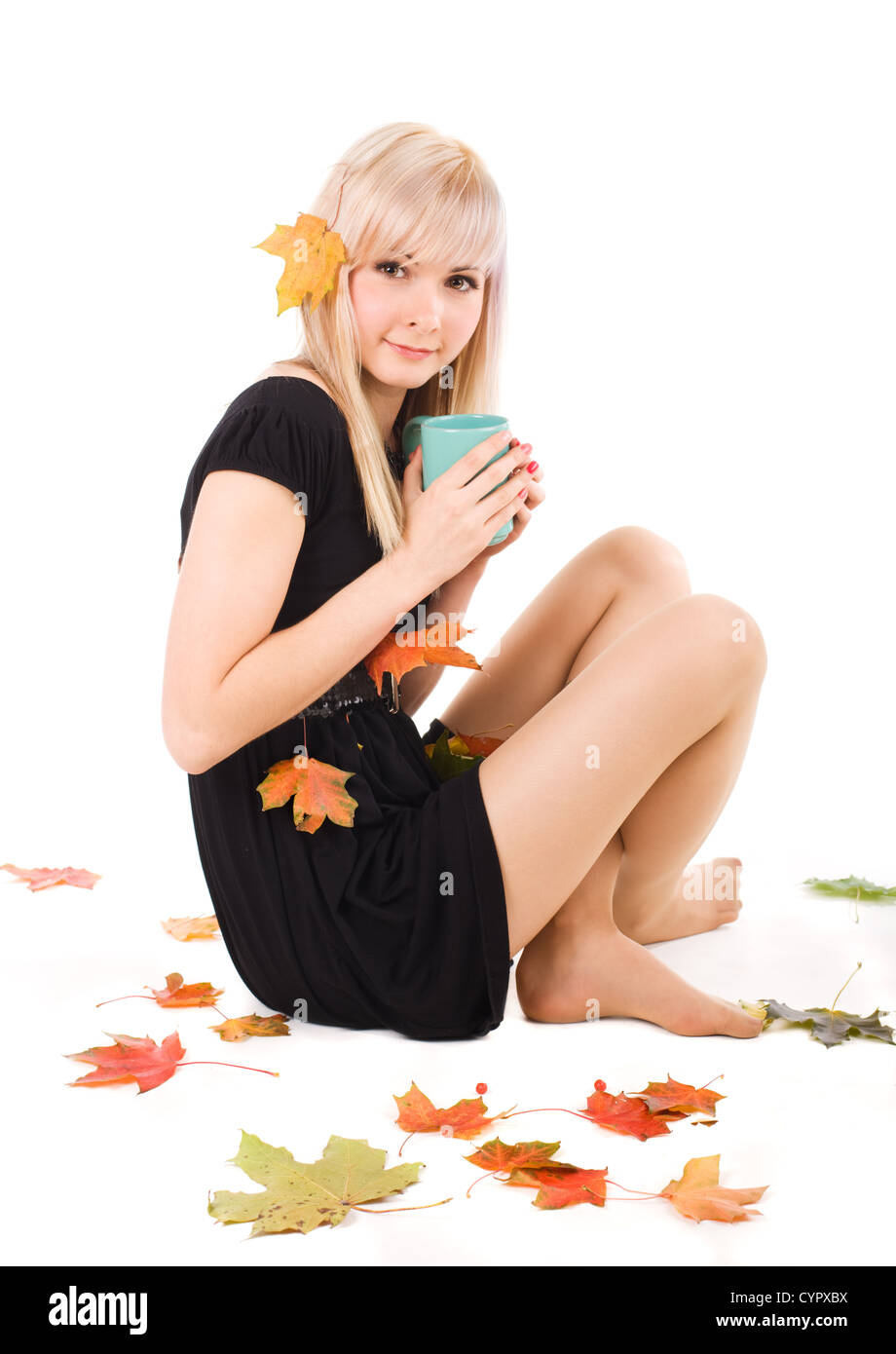 Young pretty girl warming up with a cup of tea Stock Photo