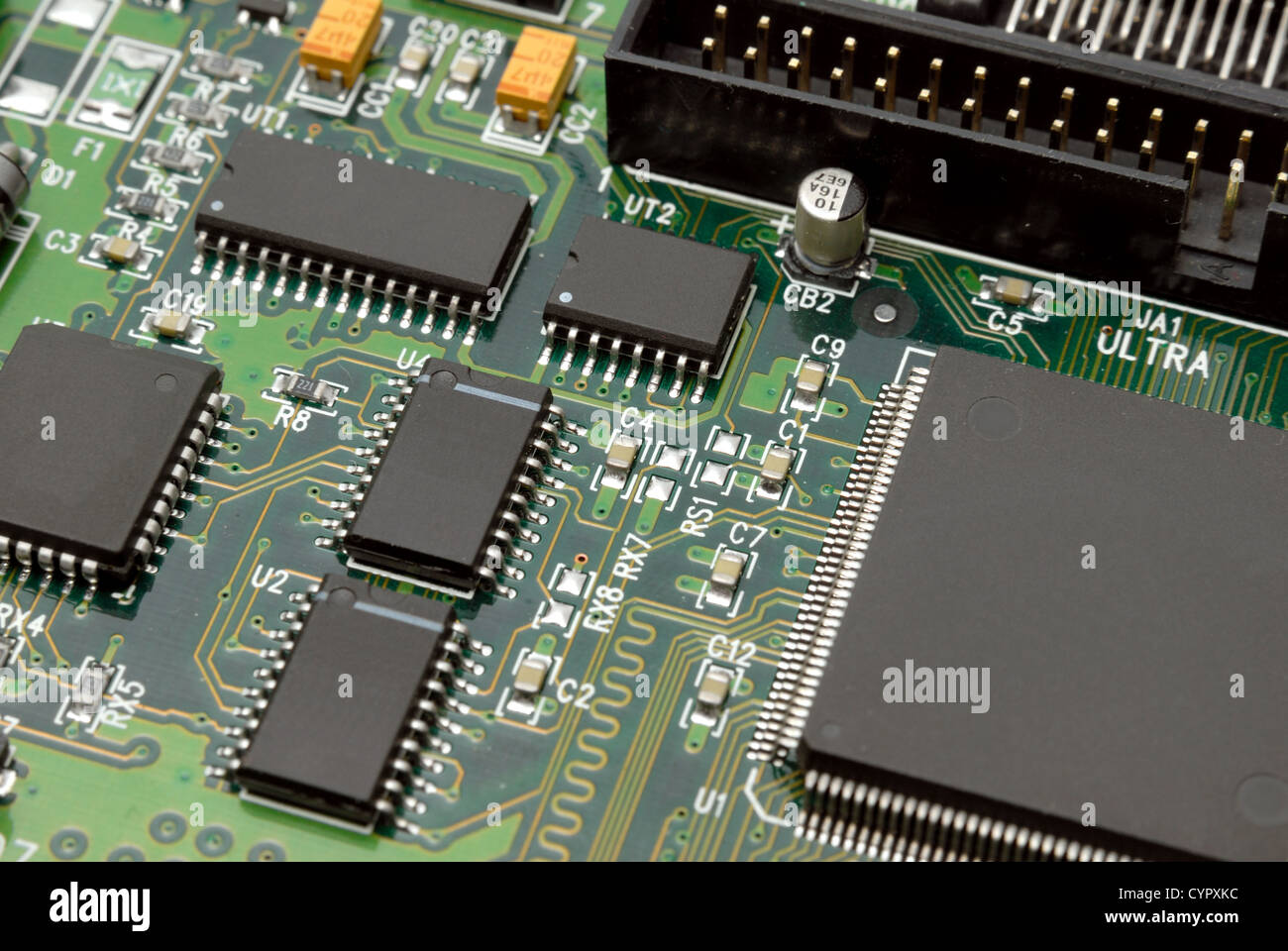 The printedcircuitboard with computer chips resistors and condensers