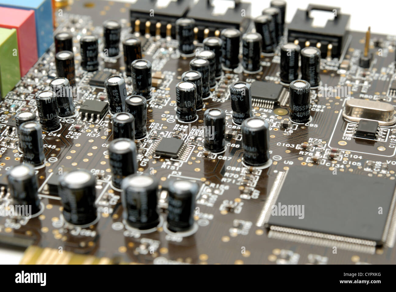 The printedcircuitboard with computer chips resistors and condensers
