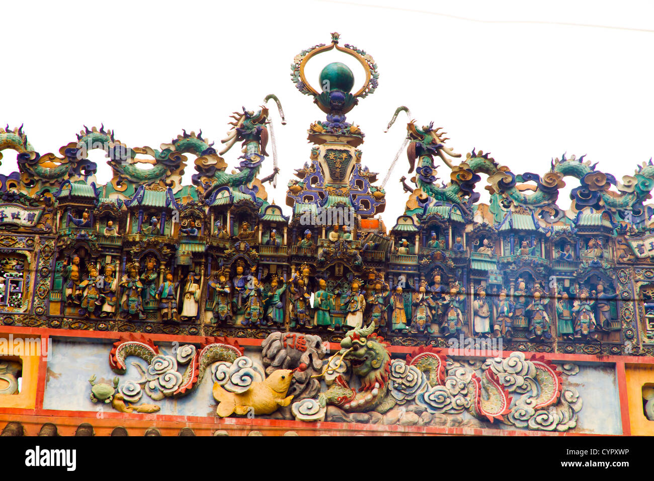 Ceramic friezes above the roof line at the Thien Hau Pagoda in Ho Chi Minh City Vietnam. Stock Photo