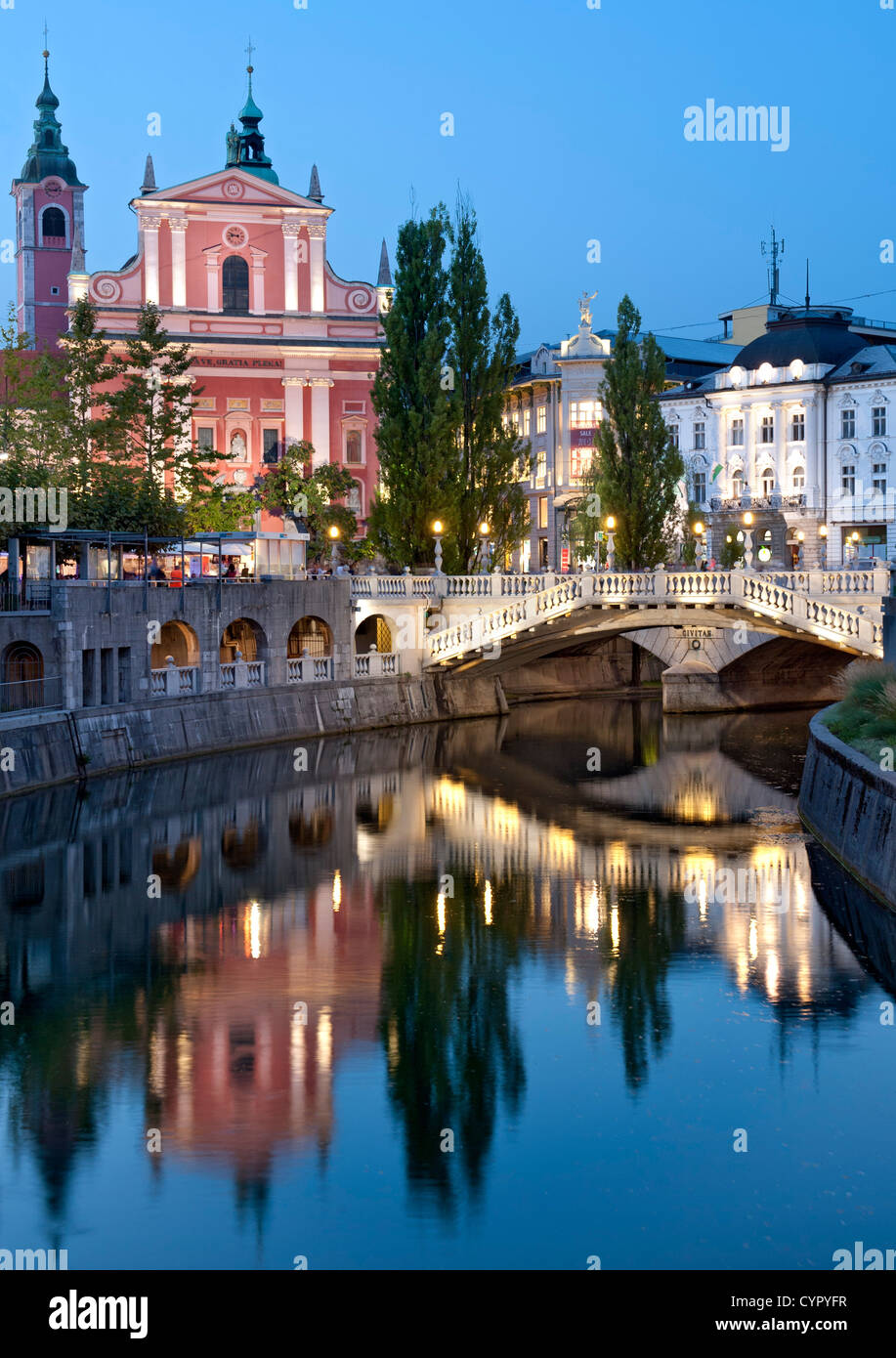 Franciscan Church of the Annunciation and the Triple Bridge over the Ljubljanica River in Ljubljana, the capital of Slovenia. Stock Photo