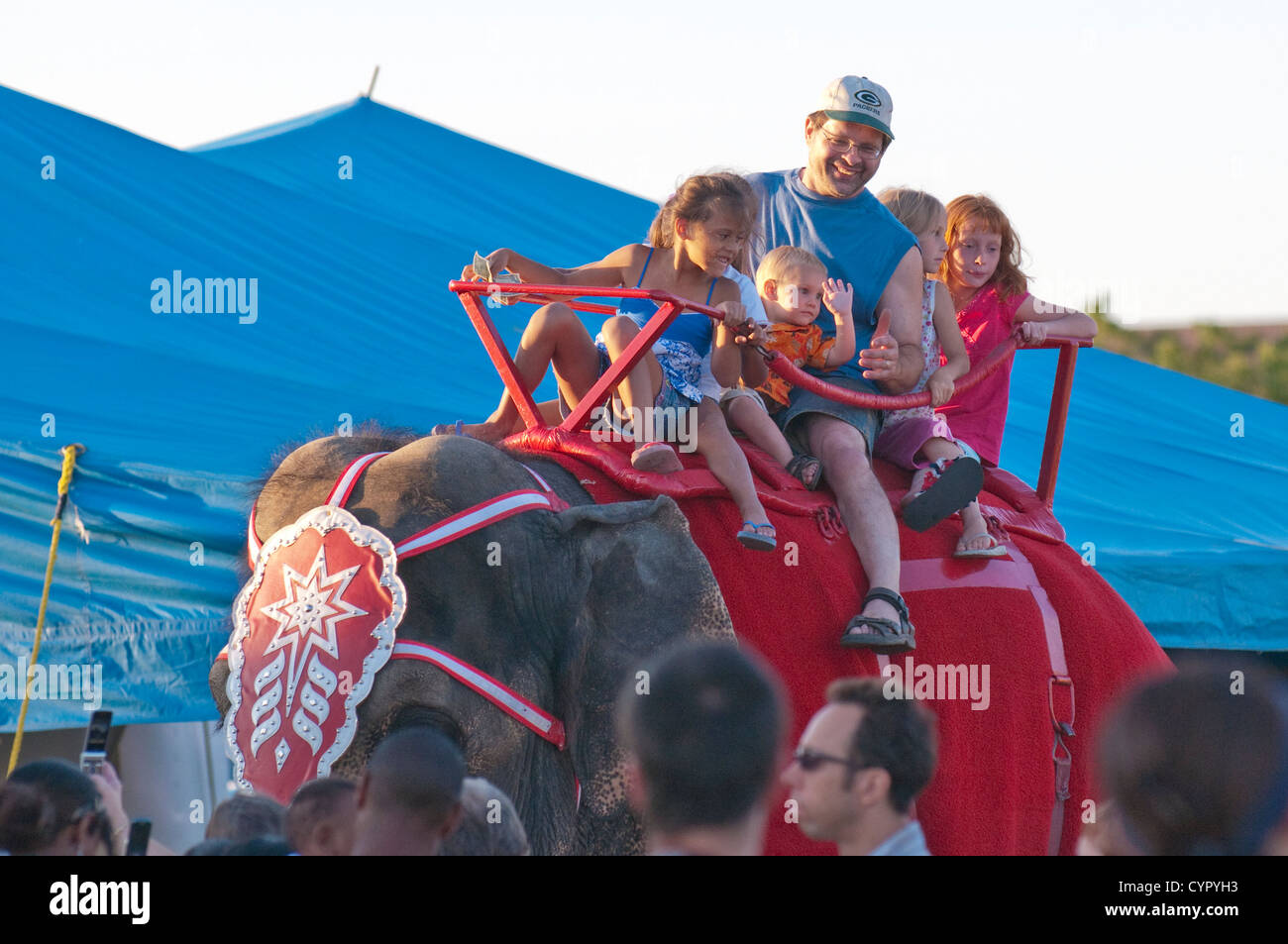 Family riding elephants at the annual Great CIrcus Parade, Milwaukee Wisconsin. Stock Photo