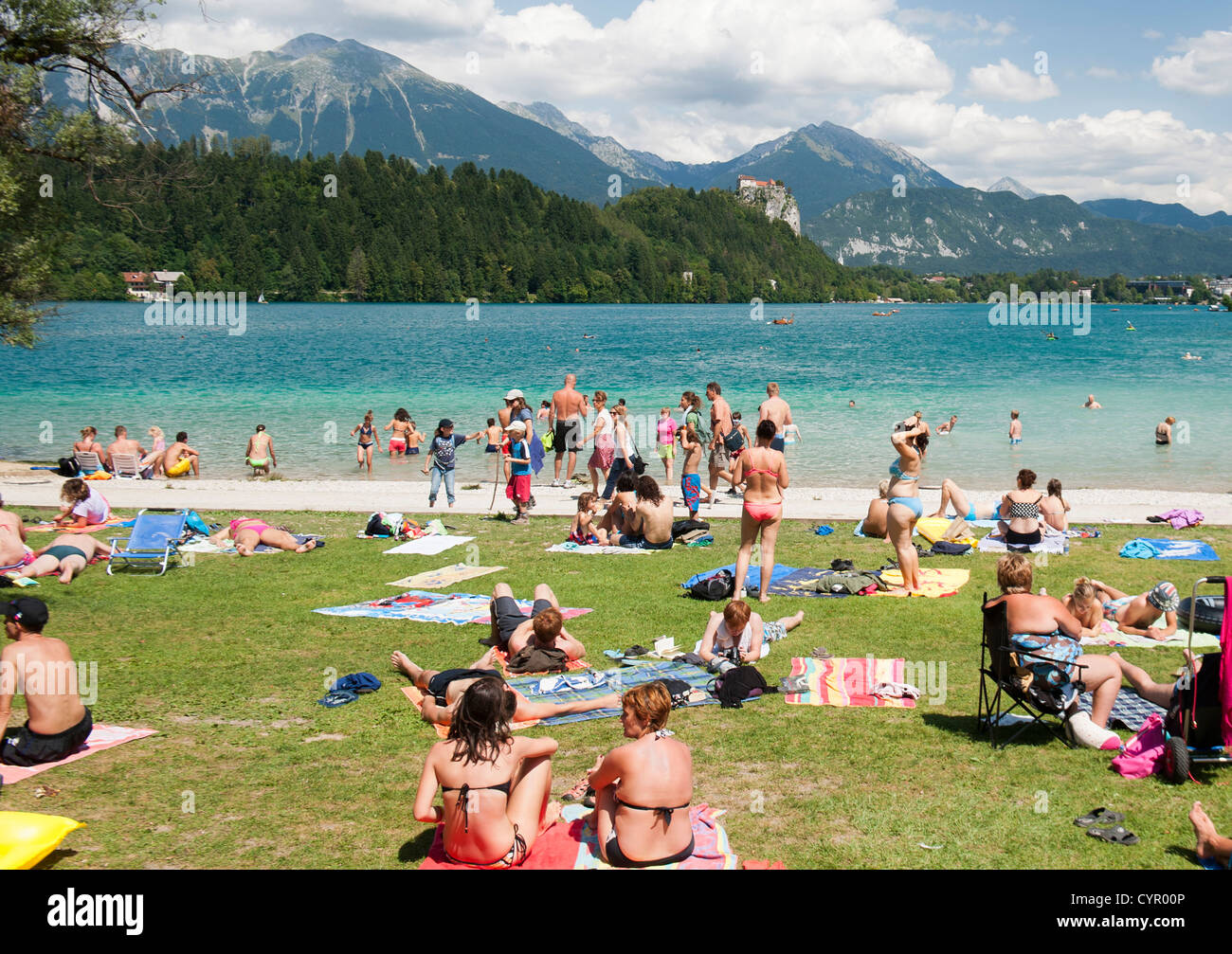 Holiday makers on the shores of Lake Bled in the Julian Alps in northwest Slovenia. Stock Photo