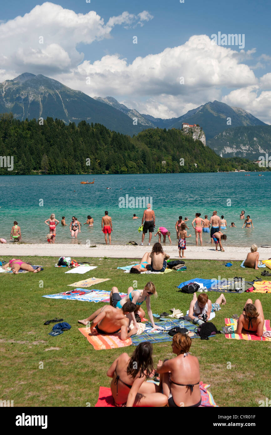 Holiday makers on the shores of Lake Bled in the Julian Alps in northwest Slovenia. Stock Photo