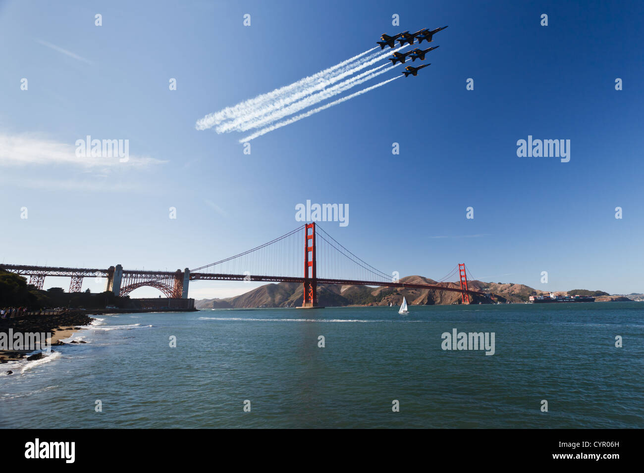 6 Fighter jets leave vapor trail as they fly over the Golden Gate Bridge in precision delta wing formation fleet week air show Stock Photo