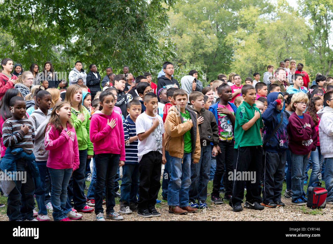Multicultural group of Texas junior high school students recite Pledge