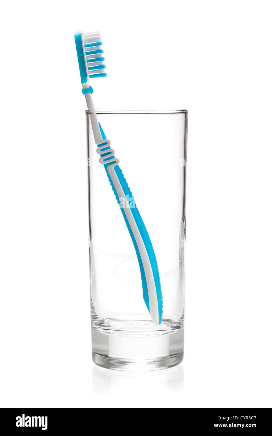 Blue tooth brush in glass. Isolated on white background Stock Photo - Alamy