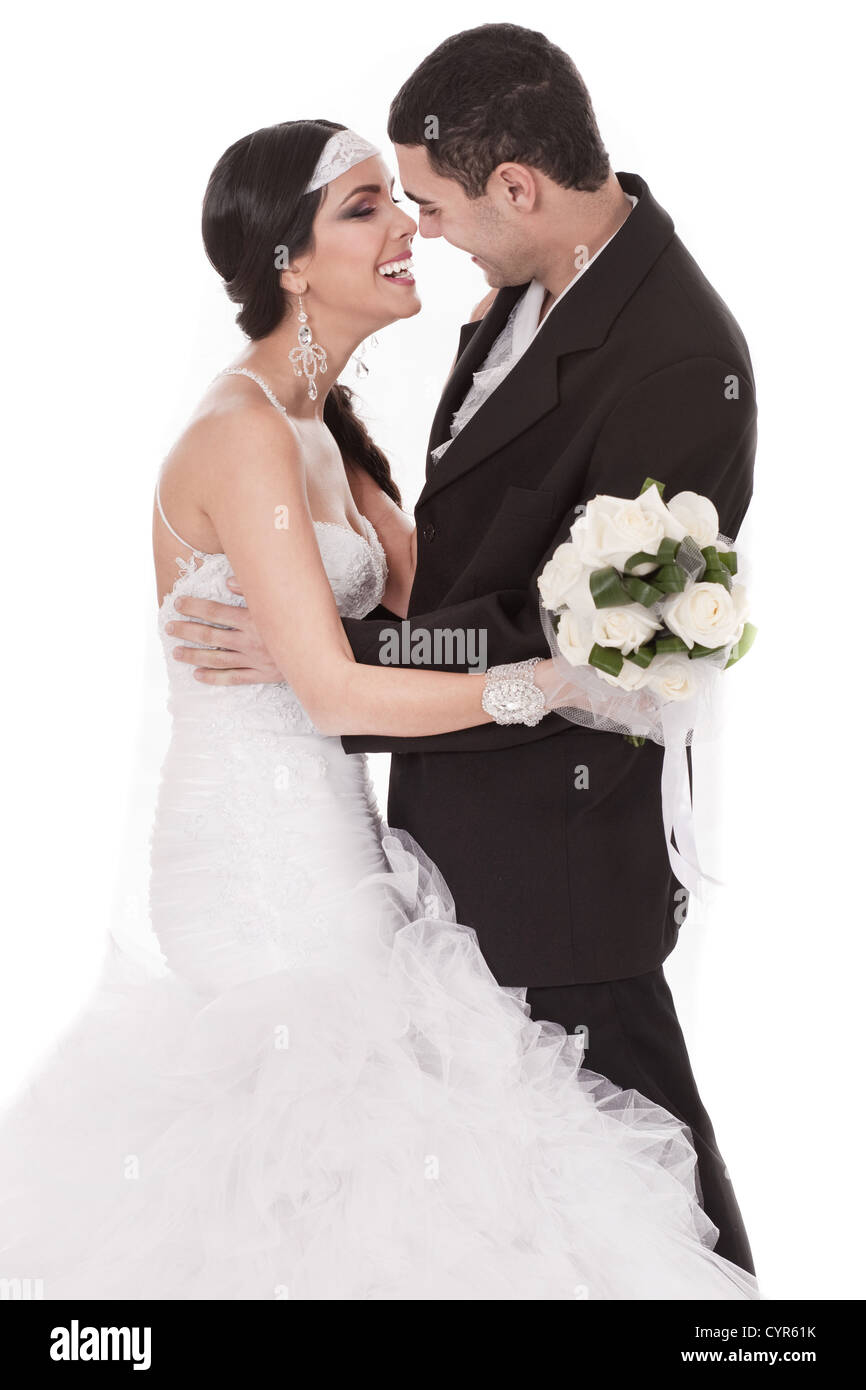 Happy bride and groom on their wedding day over white background Stock ...