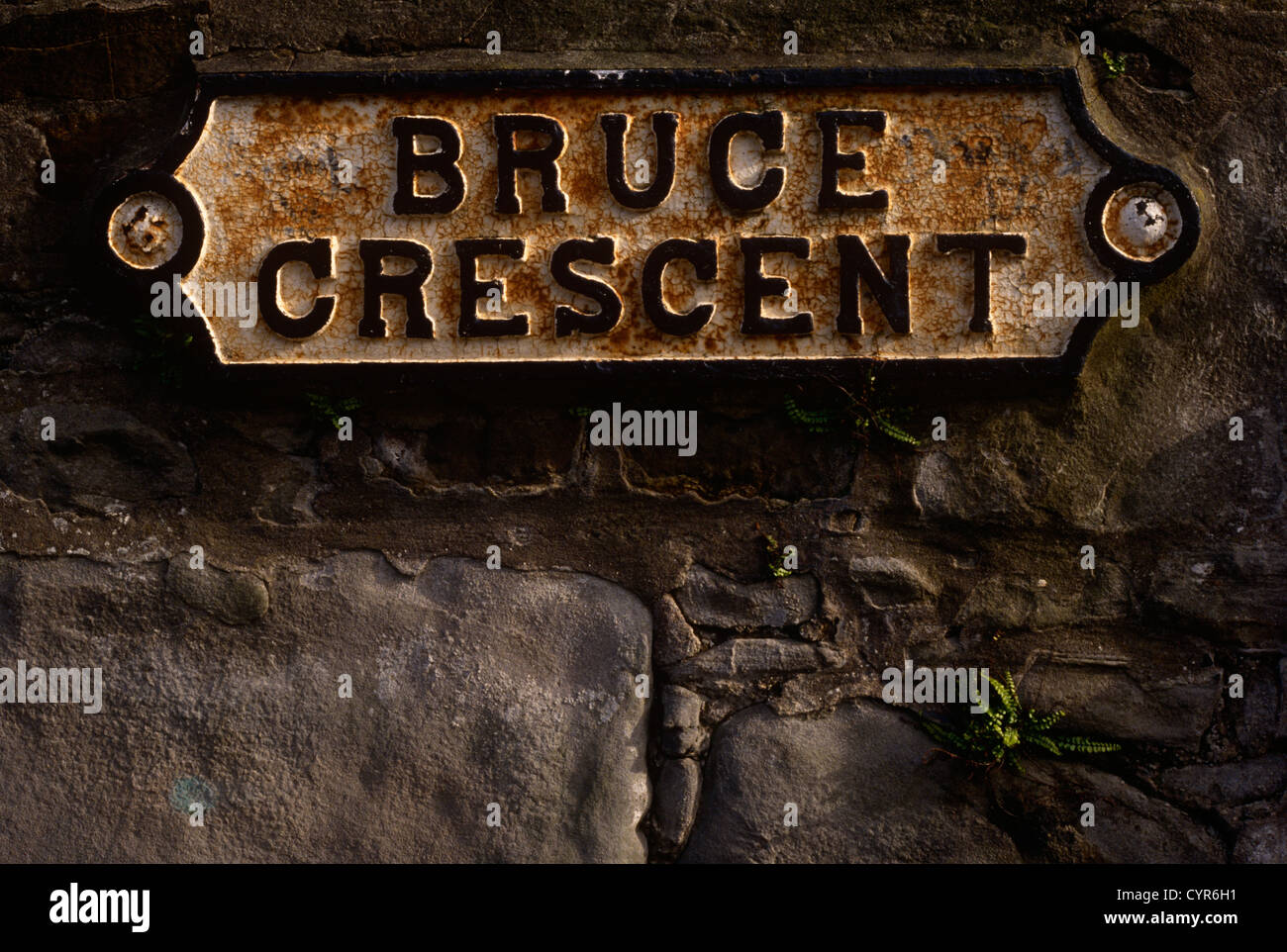 A detail of the stone wall sign for Bruce Crescent in the old area of Ayr in Scotland. Stock Photo