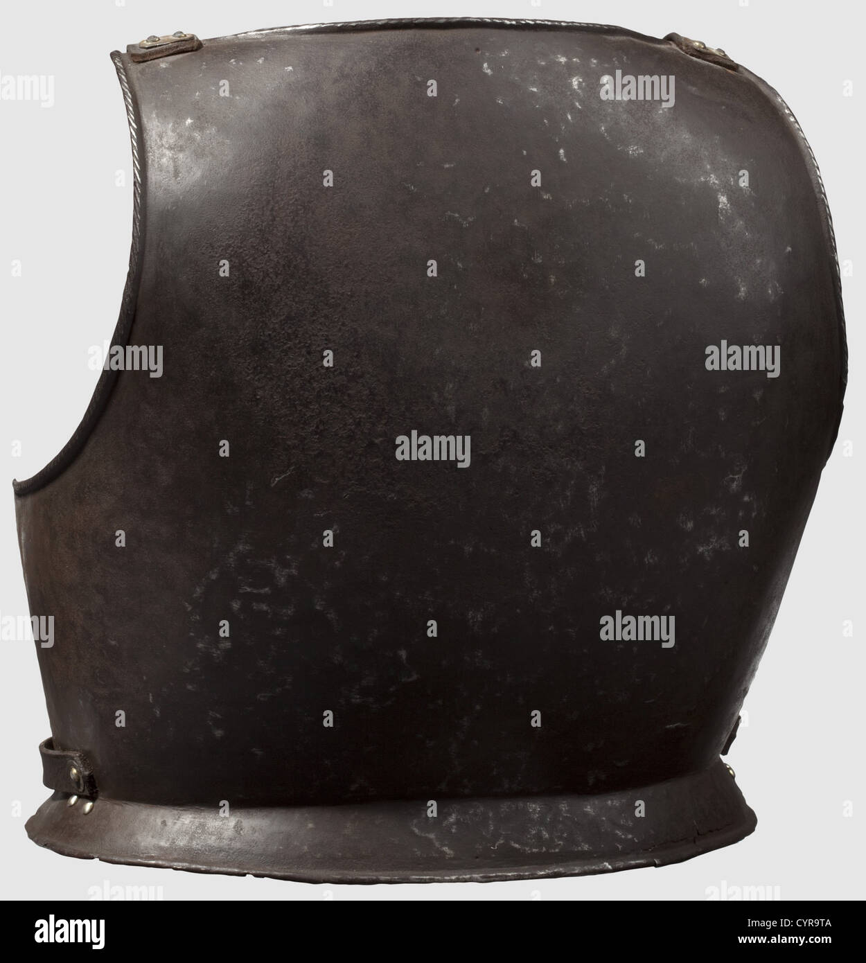 A Southern German cuirass backplate, circa 1580 Blackened backplate with turned-under rims. The neck and arm cutouts also corded. Surfaces show hammer marks and light pitting in places. The leathering replaced. Height 38.5 cm. 1, historic, historical, 16th century, defensive arms, weapons, arms, weapon, arm, fighting device, object, objects, stills, clipping, clippings, cut out, cut-out, cut-outs, utensil, piece of equipment, utensils, plating, armour-plating, armour, armor, reactive armour, armour suit, armor suit, metal, Additional-Rights-Clearences-Not Available Stock Photo