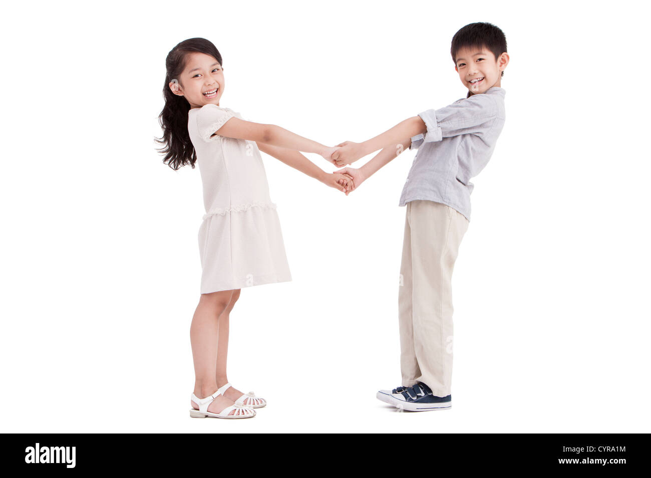 Little girl and boy holding hands Stock Photo - Alamy