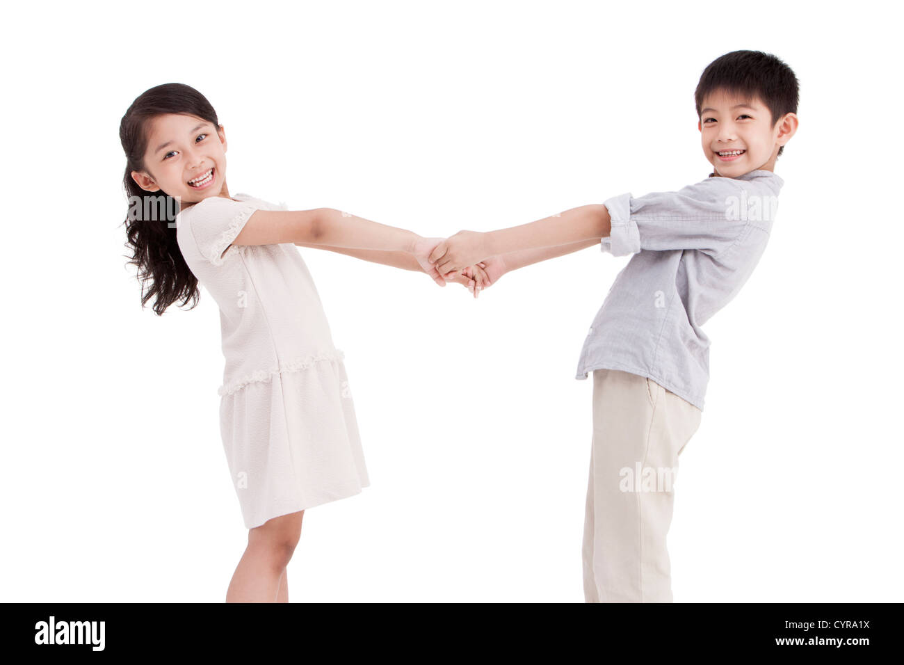 Little girl and boy holding hands Stock Photo - Alamy