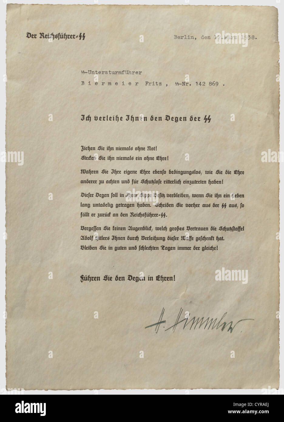 Oak Leaves Winner SS-Sturmbannnführer Fritz Biermeier,an award document to the SS officer's sword Printed on handmade paper and issued 12 March 1938,the date of his promotion to SS-Untersturmführer(2nd Lieutenant),with Himmler's signature in ink. Minimal edge damage,lightly yellowed. Fritz Biermeier(1913 - 1944)entered the SS in 1933,in 1937 he was in SS-Standarte 'Deutschland' and SS-Junkerschule Braunschweig. He won the Knight's Cross on 10 December 1943 as an SS-Hauptsturmführer(Captain)in command of 2nd Battalion,SS Panzer Regiment 3 for smashing,Additional-Rights-Clearences-Not Available Stock Photo