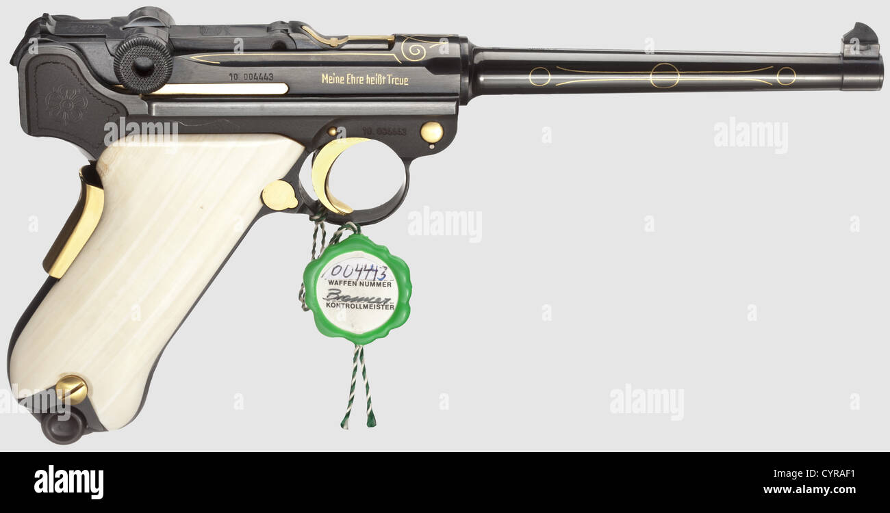 Mauser Parabellum,commemorative de luxe model,in its case,cal. 7.65 Parabellum,no. 10.004443. Matching numbers. Bright bore,barrel length 120 mm. Proof mark: 1973. Grip safety. Mauser barrel on front toggle link,barrel and fork with inlaid gold ornaments,on left side of frame in gold inlaid Gothic lettering '75 Jahre / Parabellum-Pistole / 1900 - 1975',on right side marked 'Meine Ehre heißt Treue'(Loyalty is my sense of honour). High gloss finish. Operational parts gold-plated. Ivory grip panels. Magazine. Comes with a red-brown wooden case,dimensions,Additional-Rights-Clearences-Not Available Stock Photo