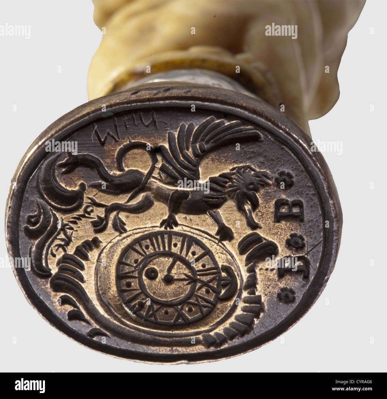 A German watchmaker's seal, 19th century Brass seal face bearing a rampant lion next to a watch dial beneath the monogram 'BB'. Finely carved ivory shaft with three intertwined cherubs and a ball finial. Height 10 cm, historic, historical, 19th century, handicrafts, handcraft, craft, object, objects, stills, clipping, clippings, cut out, cut-out, cut-outs, fine arts, art, artful, Additional-Rights-Clearences-Not Available Stock Photo