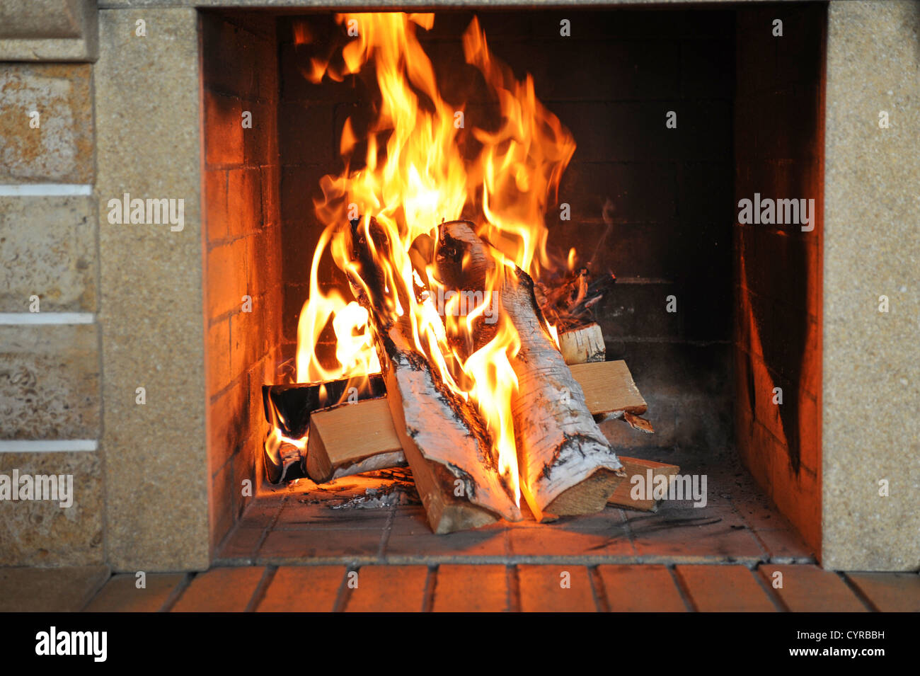 Fireplace with wood and fire closeup Stock Photo Alamy