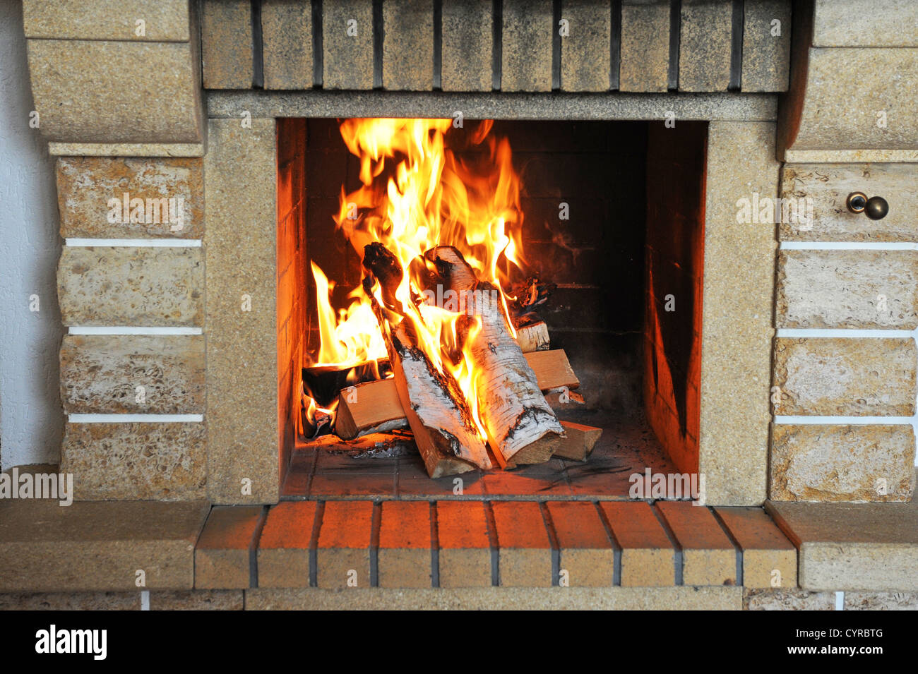 Fireplace with wood and fire closeup Stock Photo Alamy