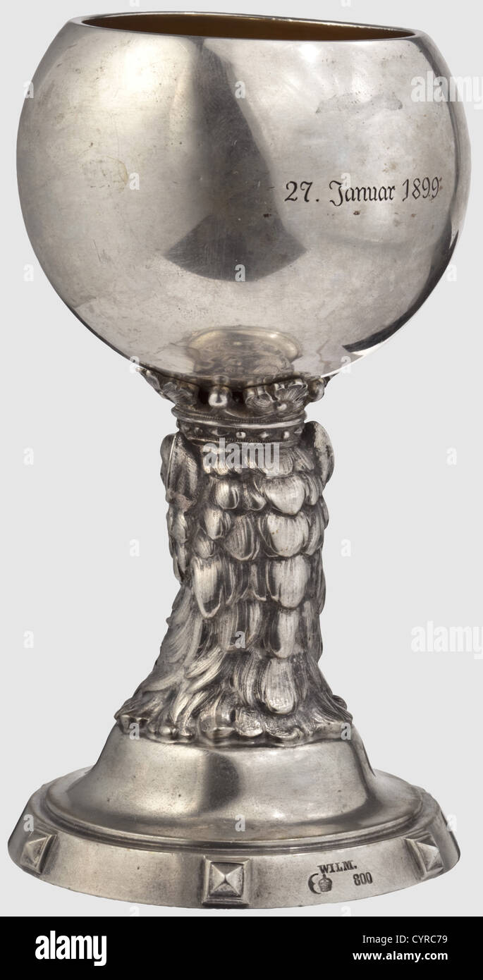 General Field Marshal August von Mackensen(1849 - 1945),a silver goblet for achieving the hereditary nobility in 1899 Silver,gilt interior.On the front of the globular bowl the engraved coat of arms of von Mackensen,an eagle's head with royal crown and date '27.Januar 1899' on the reverse side.The shaft has the form of a crowned gryphon's head,the circular base with continuous decorative studs with diamond cut as well as jeweller's mark and hallmark 'Wilm - 800'.Height 13.5 cm,weight 213 g.Awarding a coat of arms with an eagle,the heraldic animal of,Additional-Rights-Clearences-Not Available Stock Photo