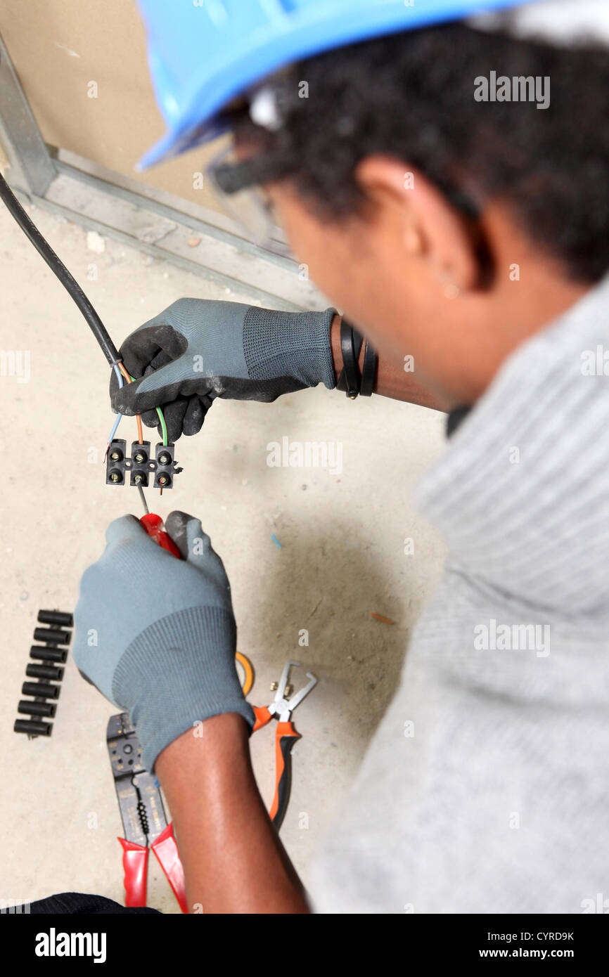 Electrician wiring a 'chocolate block' connector Stock Photo Alamy