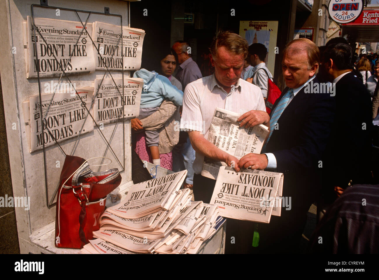 A Newspaper seller displays copies of the London tabloid aimed at commuters The Evening Standard Stock Photo