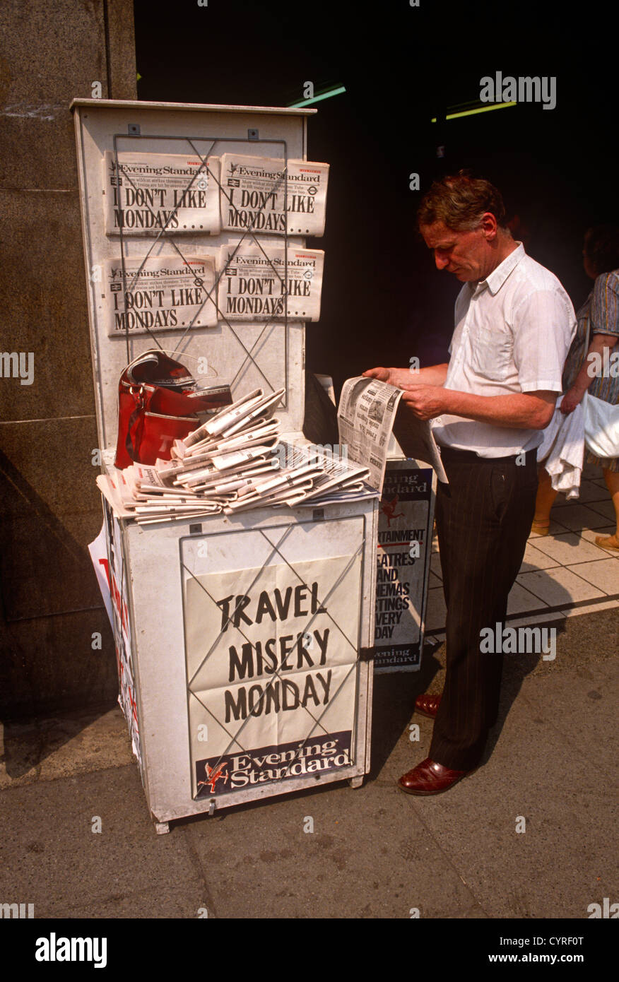 A Newspaper seller displays copies of the London tabloid aimed at ...