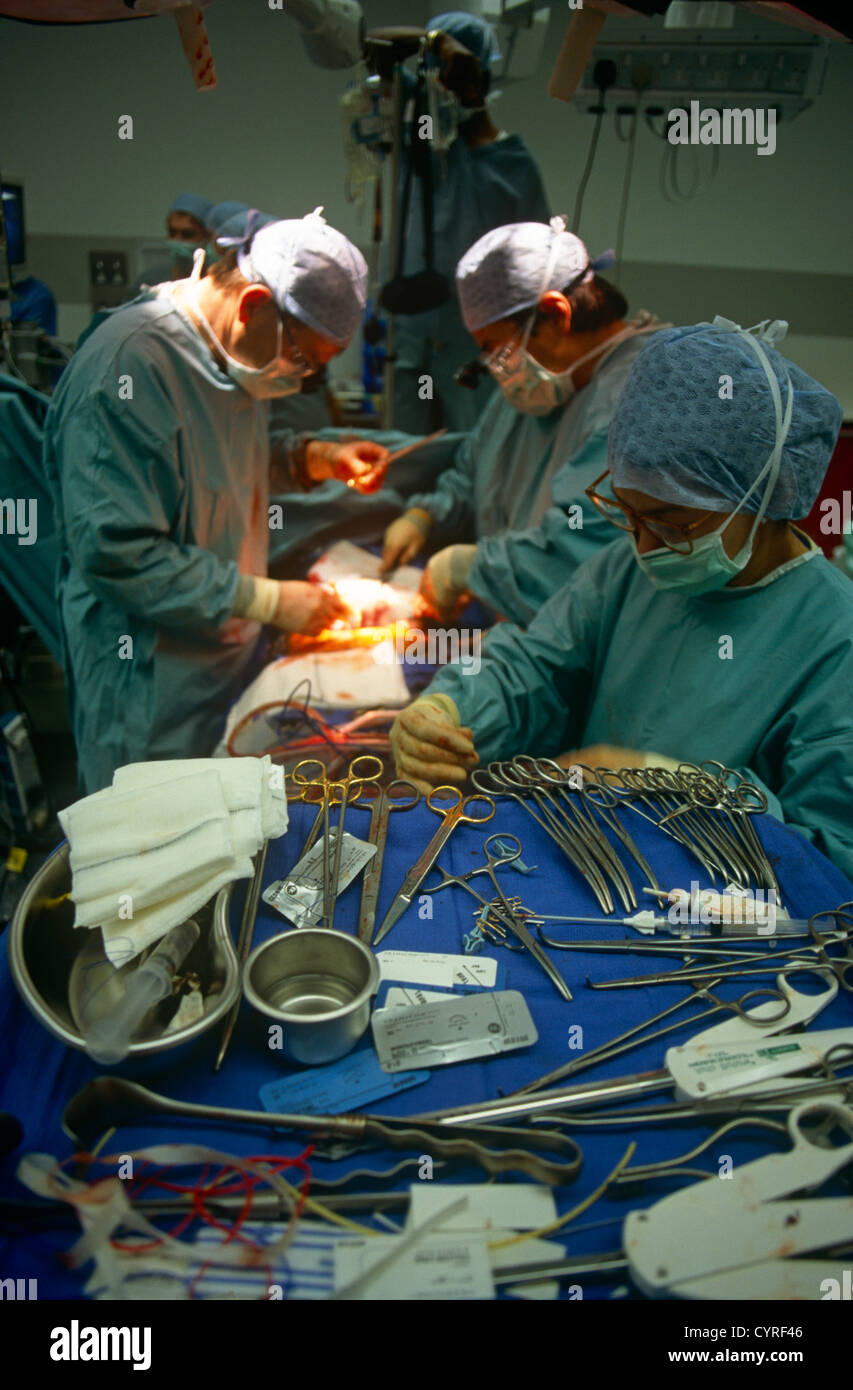 Surgeons performs open heart surgery during a procedure at the private Health Care International hospital in 1994, Glasgow. Stock Photo