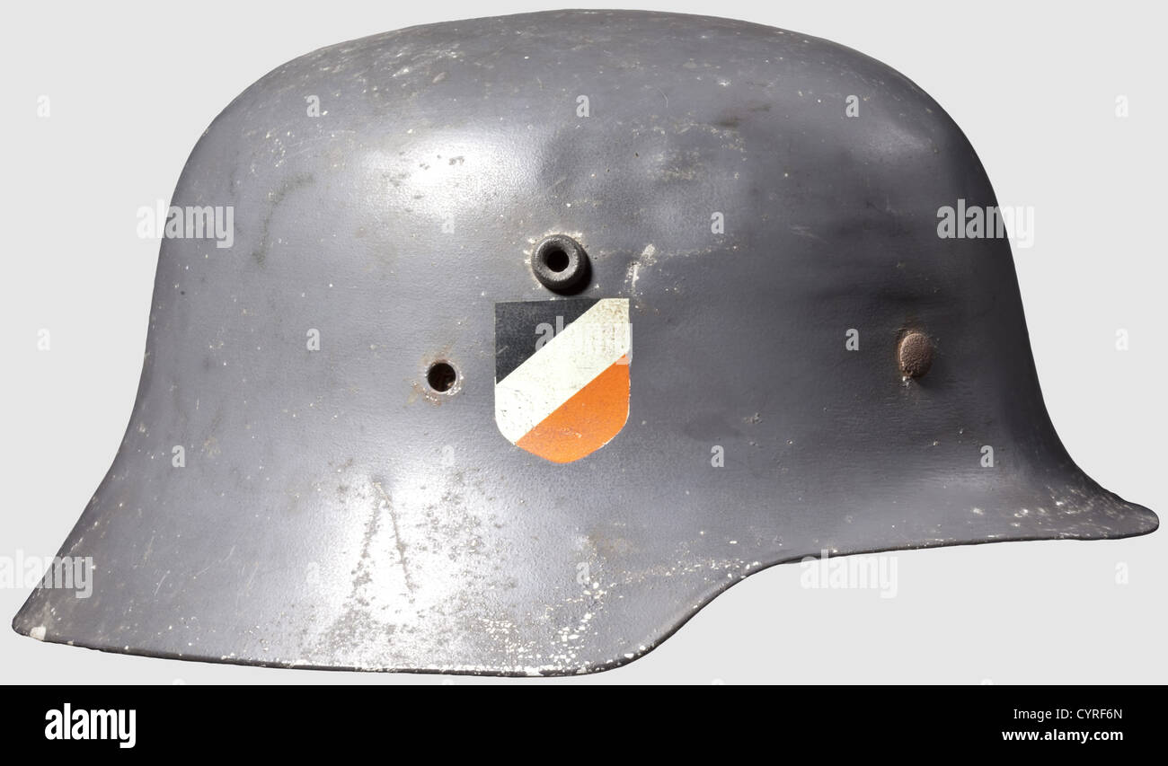 A parade steel helmet for officers,with both insignia Aluminium shell,similar to M 16,with Luftwaffe blue paint. The eagle is 95 % and the national shield 90 % intact. One of the five attachment clamps on the inner liner is missing,inner liner and chinstrap damaged,traces of corrosion,historic,historical,1930s,1930s,20th century,Air Force,branch of service,branches of service,armed service,armed services,military,militaria,air forces,object,objects,stills,clipping,clippings,cut out,cut-out,cut-outs,defensive arms,weapon,weapons,pro,Additional-Rights-Clearences-Not Available Stock Photo