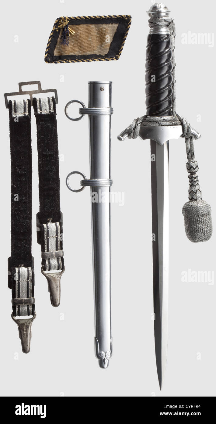 A model 38 'Bahnschutz' leader's dagger(Railway special protection force),complete with hanger and sword-knot With unmarked blade,aluminium crossguard and pommel,black plastic grip,silver coloured sword-knot with black interweave,and iron scabbard(the latter with small spots). Length 38 cm. The hanger faced with interwoven silver thread and black fabric matching the portepee,with black velvet backing and silver-plated mounts. Also a single Railway uniform collar patch. Very rare dagger and hanger,historic,historical,1930s,1930s,20th century,thrust,Additional-Rights-Clearences-Not Available Stock Photo