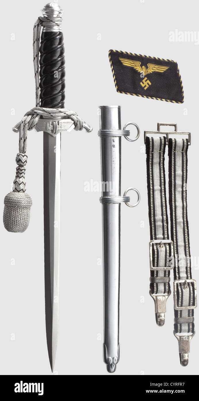 A model 38 'Bahnschutz' leader's dagger(Railway special protection force),complete with hanger and sword-knot With unmarked blade,aluminium crossguard and pommel,black plastic grip,silver coloured sword-knot with black interweave,and iron scabbard(the latter with small spots). Length 38 cm. The hanger faced with interwoven silver thread and black fabric matching the portepee,with black velvet backing and silver-plated mounts. Also a single Railway uniform collar patch. Very rare dagger and hanger,historic,historical,1930s,1930s,20th century,thrust,Additional-Rights-Clearences-Not Available Stock Photo