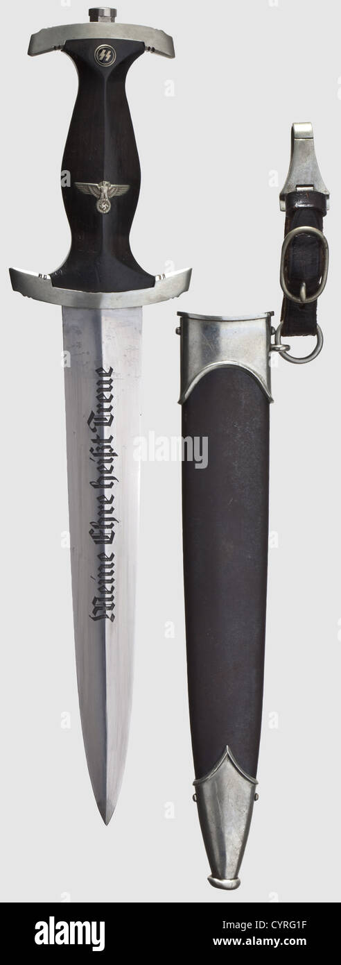 A model 34 SS honour dagger with Röhm dedication,The blade etched on the obverse side with the motto 'Meine Ehre heißt Treue'(My Honour is Loyalty),and on the reverse with the 'Rich.Herder Solingen' logo and the dedication,'In herzlicher Kameradschaft Ernst Röhm'(In Cordial Comradeship Ernst Röhm).Black wooden grip with inlaid emblems.The nickel-silver crossguard marked 'I' on the side and '270029' underneath.Rust-coated iron scabbard with remnants of the black finish,and nickel-silver mounts.Leather suspension.Length 34.5 cm.Very rare dagger,histo,Additional-Rights-Clearences-Not Available Stock Photo