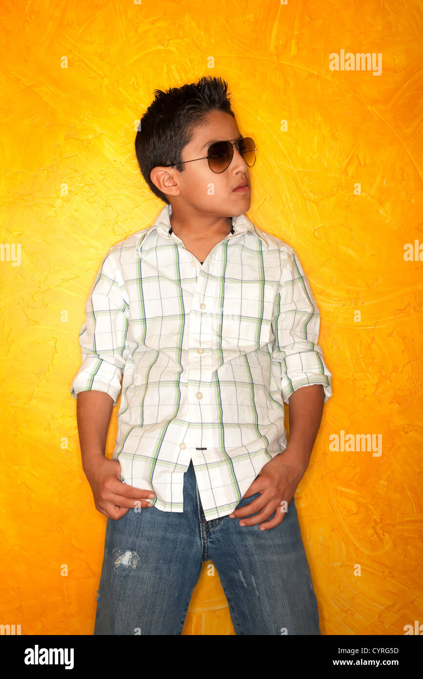 Handsome young Hispanic boy wearing sunglasses Stock Photo Alamy