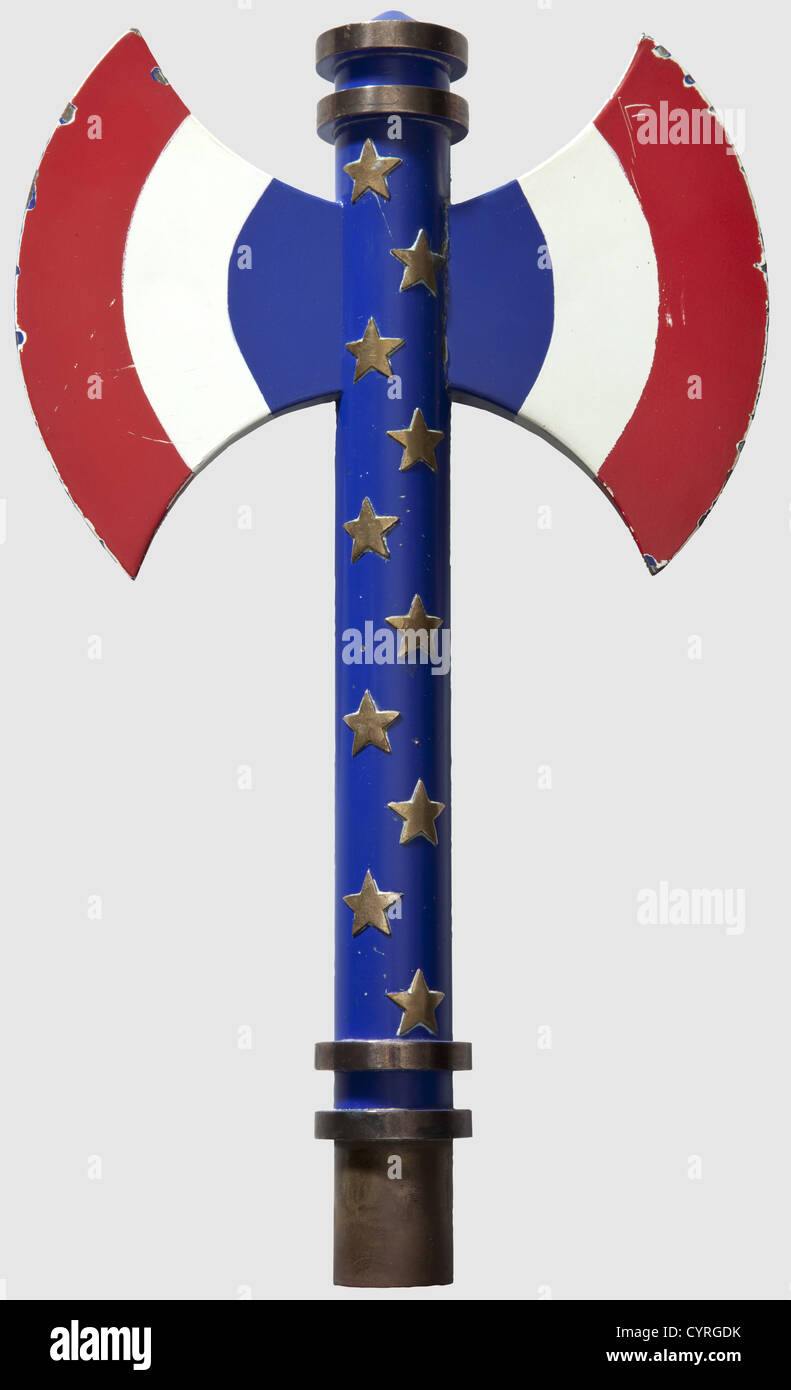 Finial of the national flag of the 'Légion Fran‡aise des Combattants',Vichy France.Gilt copper,enamelled and lacquered.Francisca in blue,white and red with twenty marshal stars(one with remains of solder).Two pierced holes for attachment and one banner hook(repaired).Diameter 3 cm,height 33 cm,weight 650 g.One of the blades repaired,small loss.The battle axe was the symbol of the Vichy government.On 29 August 1940 the 'Légion Fran‡aise des Combattants' was founded by Xavier Vallat under the patronage of Marshal Pétain as a political organisation ,Additional-Rights-Clearences-Not Available Stock Photo