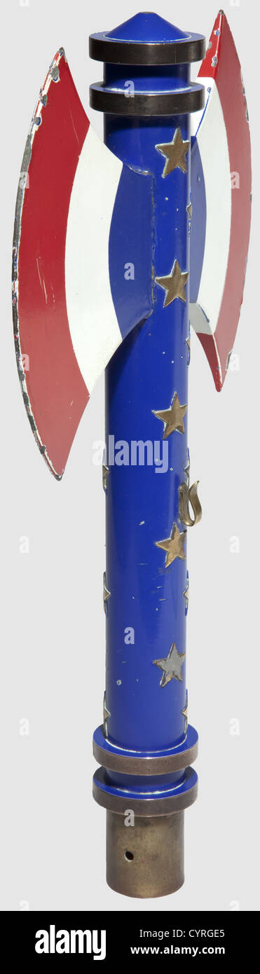Finial of the national flag of the 'Légion Fran‡aise des Combattants',Vichy France.Gilt copper,enamelled and lacquered.Francisca in blue,white and red with twenty marshal stars(one with remains of solder).Two pierced holes for attachment and one banner hook(repaired).Diameter 3 cm,height 33 cm,weight 650 g.One of the blades repaired,small loss.The battle axe was the symbol of the Vichy government.On 29 August 1940 the 'Légion Fran‡aise des Combattants' was founded by Xavier Vallat under the patronage of Marshal Pétain as a political organisation ,Additional-Rights-Clearences-Not Available Stock Photo