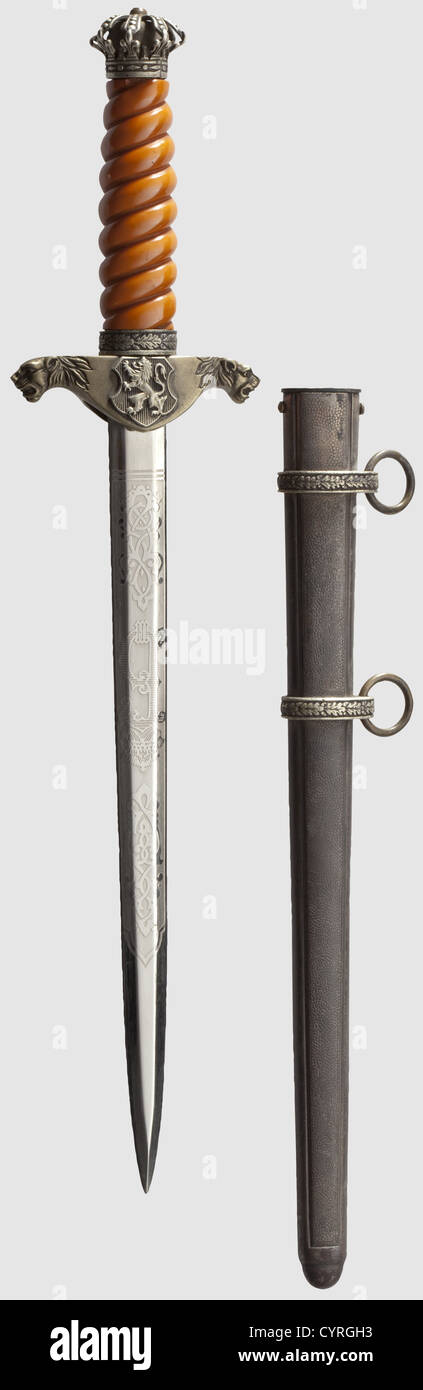An honour dagger for officers of the royal Bulgarian army,Reign of Tsar Boris III(1918-1943)Nickel-plated blade with the Cyrillic cipher 'B III' on one side and the Cyrillic motto 'God with us' on the other face each between decorative floral etchings. Silver-plated quillons with lion head finials,the coat of arms riveted on the obverse side,and an enamelled miniature of the Red Cross Honours Medal(re-attached with glue)on the reverse side. Silver-plated,openwork pommel in the shape of the Tsar's crown,slightly deformed,the cross missing. Orange-colou,Additional-Rights-Clearences-Not Available Stock Photo